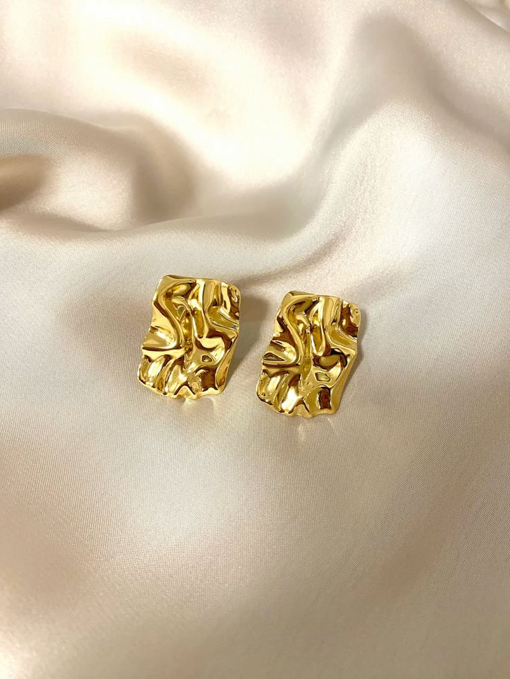 Pair of gold stud earrings